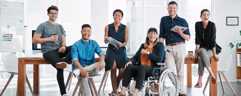 A group of white-collar professionals of different races and physical abilities