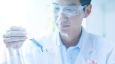 Scientist holding a test tube in a laboratory